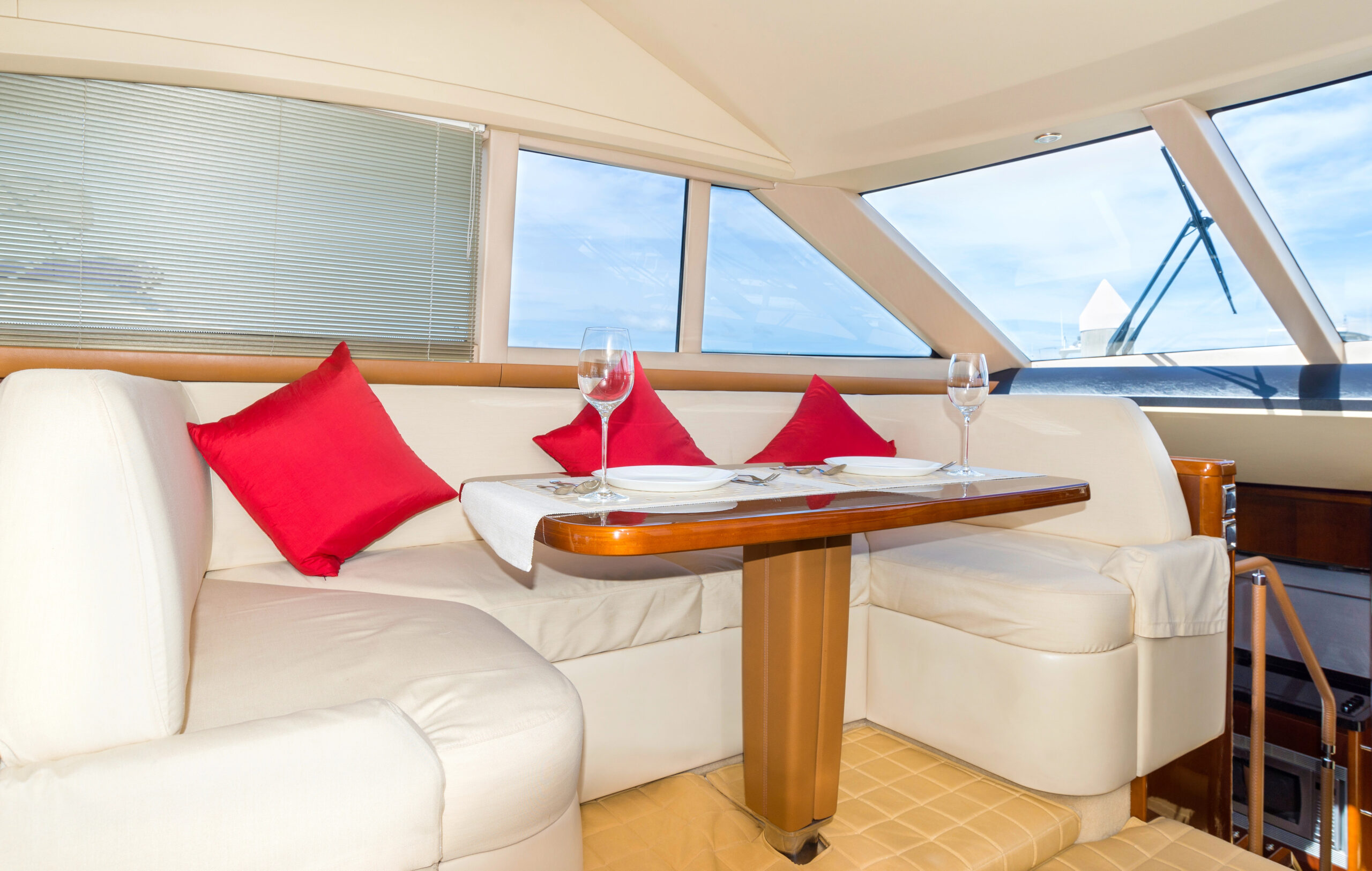 Luxury lunch table setting on a yacht interior, comfortable design for holiday recreation tourism travel and vacation